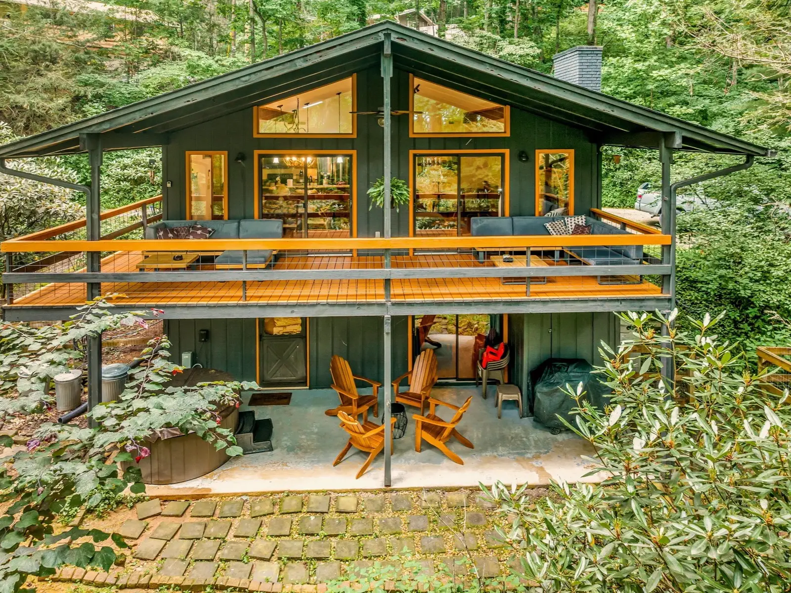 The Glenway Chalet’s front deck, set in the trees